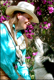 Krista Cantrell, cognitive animal behaviorist, qigong practitioner, shaman, and agility instructor, with her Border Collie Jet